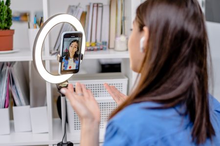 girl-blogger-influencer-talking-smartphone-live-recording-video-blog-on-social-network-at-home-1-1-1